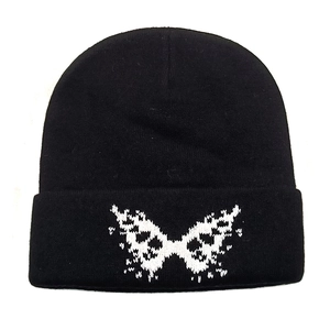 Chic black knitted beanie with white butterfly embroidery and foldable cuff for winter warmth