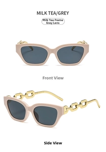 Detail of milk tea frame cat eye sunglasses with thick gold metal chain temples and grey lenses