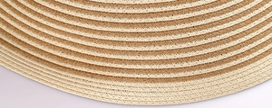 Close-up of dual-tone straw weave texture and striped patterns on a retro sun hat
