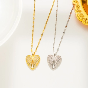 Sparkling angel wing heart pendant necklace in gold and silver finish with zircons