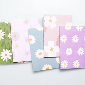 Set of five mini creative daisy notebooks in pastel colors for students and office use