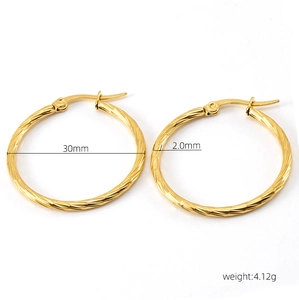 Detailed view of 30mm twisted gold hoop earrings showing 2.0mm thickness and 18K finish