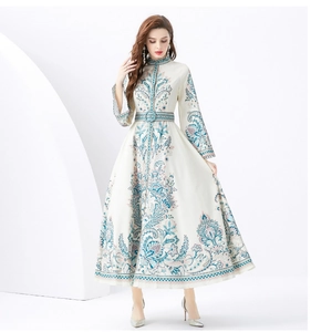 Detail of elegant paisley floral print and matching belt on a luxury maxi dress