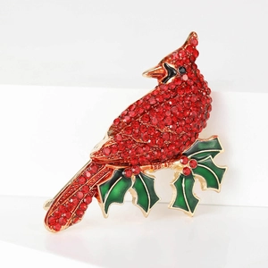 Elegant cardinal bird brooch with red rhinestones and green enamel holly branch detail