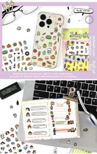 Detail showing cute cartoon stickers applied on a phone case and notebook with soft lighting
