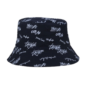 Reversible black cotton bucket hat with white Thug Life graffiti letter embroidery