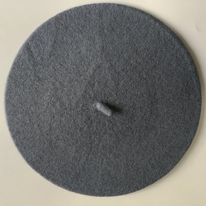 Detailed top view of a dark grey wool cashmere beret showing its fine textured fabric