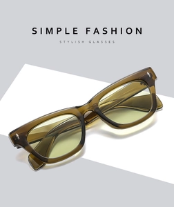 Detailed shot of amber square sunglasses frame with silver arrow metal decorations