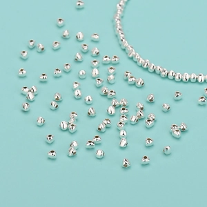 Irregular S925 sterling silver nugget beads scattered on blue background for DIY jewelry