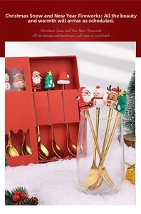 Macro view of Christmas cutlery set with golden spoons and forks in a red festive gift box