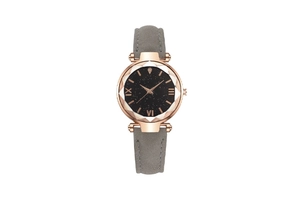 Macro detail of rose gold geometric bezel and starry black dial on a fashion watch