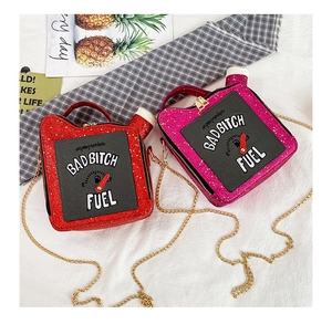 Macro shot of sequin fuel can bag with BADBITCH FUEL embroidery and gold chain strap