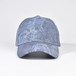 Detailed view of deep blue baseball cap with sparkling rhinestones in a python texture