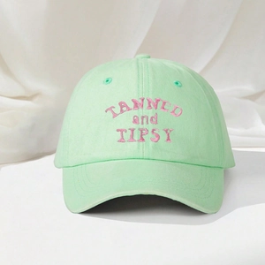 Mint green baseball cap with pink TANNED and TIPSY embroidery for outdoor sun protection