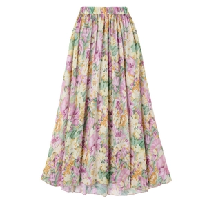 Detail of high-waisted floral chiffon skirt with elastic waist and vibrant flower patterns