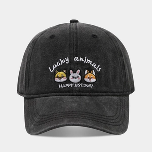 Close-up of the vintage animal embroidery on a washed denim baseball cap with sharp detail