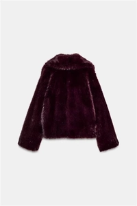 Detail view of plush dark purple faux fur jacket texture and rear silhouette design