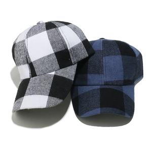 Classic British style checkered baseball caps in black-white and black-blue patterns