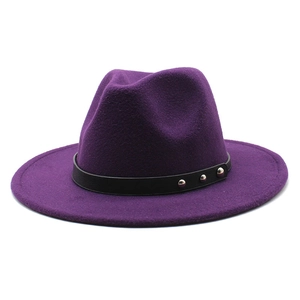 Detail of purple wool fedora featuring black leather band and silver rivet accents