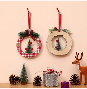 Detail of Christmas tree ornaments with plaid fabric and wood carvings on a festive wall