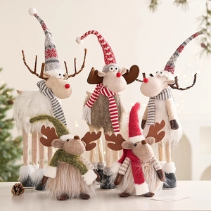 Five assorted Nordic felt Christmas reindeer figurines with knitted scarves and hats