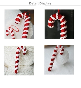 Detail of red glitter candy cane ornaments with white pom-poms and hanging ribbons