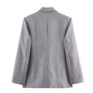 Back view of a grey herringbone blazer with padded shoulders and tailored fit texture