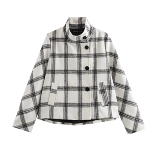 Detail of black and white plaid wool jacket with stand collar and large buttons