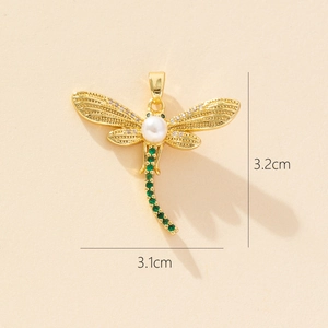 Detailed size view of gold dragonfly pendant with pearls and green zircons 3.2cm x 3.1cm