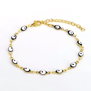 Close-up of golden evil eye bracelet with lobster clasp and adjustable tail chain