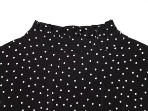 Detail of ruffled stand collar on black and white polka dot chiffon dress for women