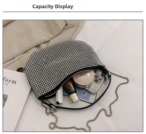 Spacious silver rhinestone hobo bag showing interior capacity for phone and cosmetics