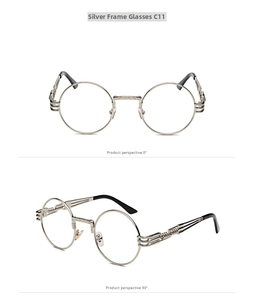 Detail view of steampunk round metal glasses with carved bridge and spiral temples