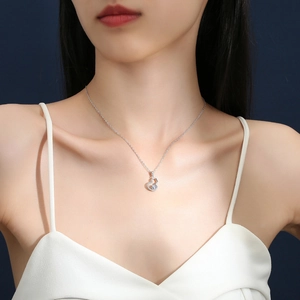 S925 sterling silver gourd necklace with moissanite pendant shown on a female model