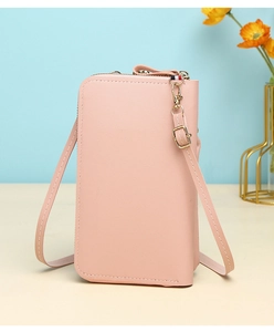 Detailed view of pink lychee textured PU leather phone bag with zip and shoulder strap