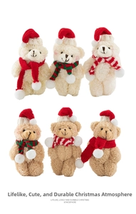 Detail showing plush Christmas teddy bear pendants in cream and brown with striped scarves