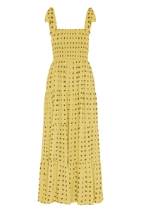 Detail of yellow checkered maxi dress featuring elastic smocked chest and tiered skirt