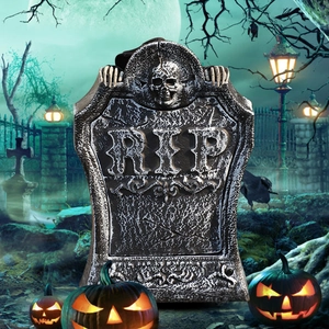 Animated Halloween tombstone with glowing skull and RIP engraving in spooky cemetery scene