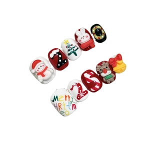 Handmade 3D Christmas press-on nails featuring reindeer, snowman and tree festive patterns