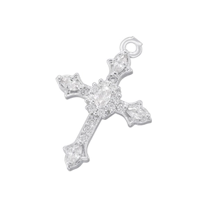 Macro shot of silver cross pendant featuring colorful crystal settings and hanging ring