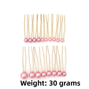 Detail of 18 pink pearl U-shaped bridal hair pins with gold alloy stems weighing 30g