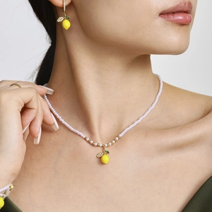 Set collana di perle in acciaio inox con pendente limone e orecchini abbinati