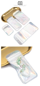 Macro detail of holographic rainbow ziplock bags in four sizes for jewelry packaging