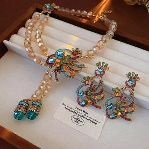 Vintage peacock jewelry set with multi-color rhinestones and champagne beaded necklace