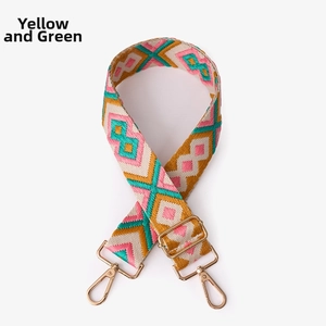 Detailed view of bohemian style woven bag strap with geometric patterns and gold hardware