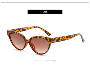 Detail view of brown leopard print cat eye sunglasses with gradient tea lenses C04