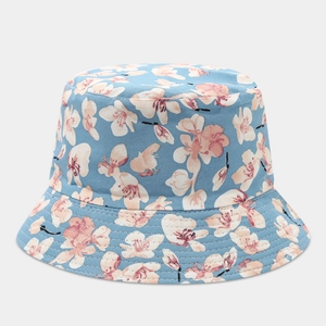 Detail of light blue floral bucket hat featuring cherry blossom patterns and stitched brim