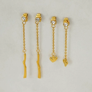 Elegant gold-plated tassel earrings with rhinestones featuring heart and branch charms