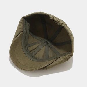 Army green vintage newsboy cap with six-panel cotton construction and elastic back strap