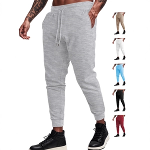 Men's waffle knit drawstring jogger pants in gray with multiple color options shown